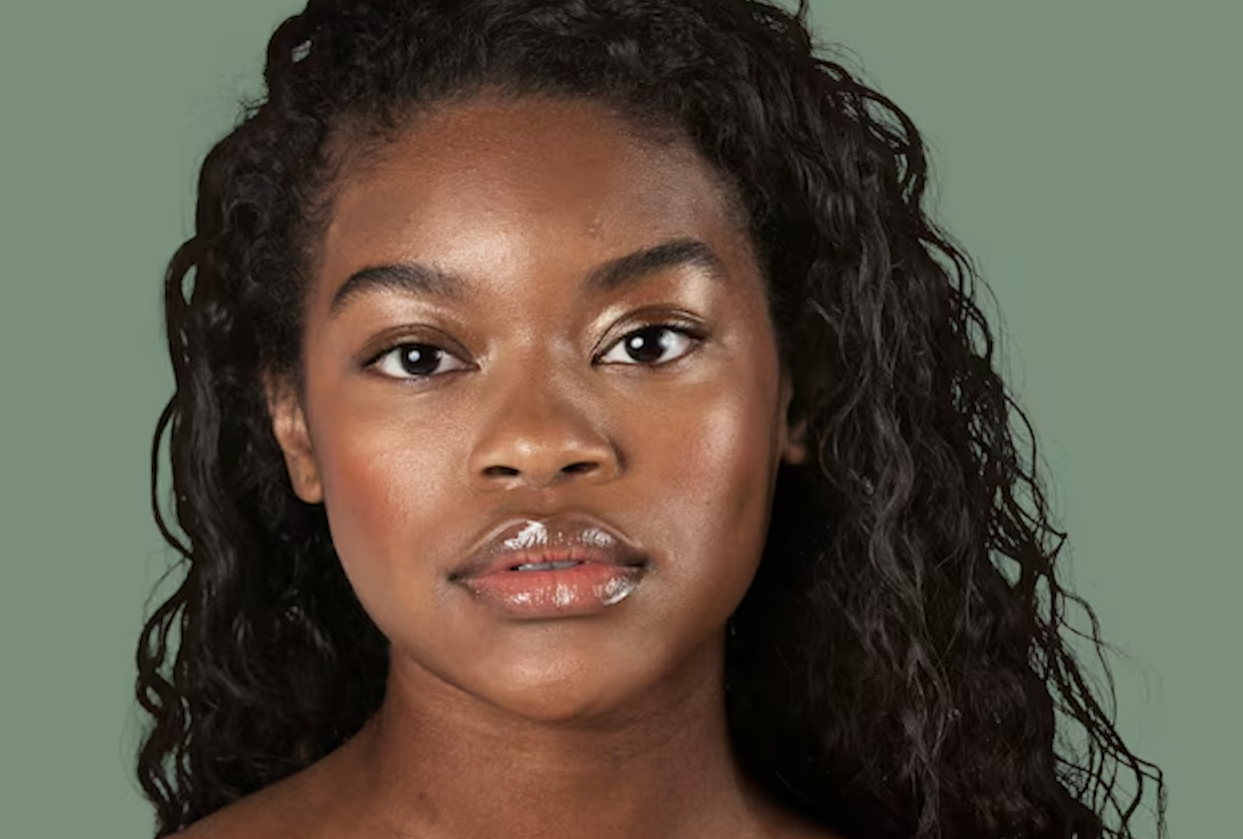 Young man with dark hair and beard, brown eyes, blue t-shirt